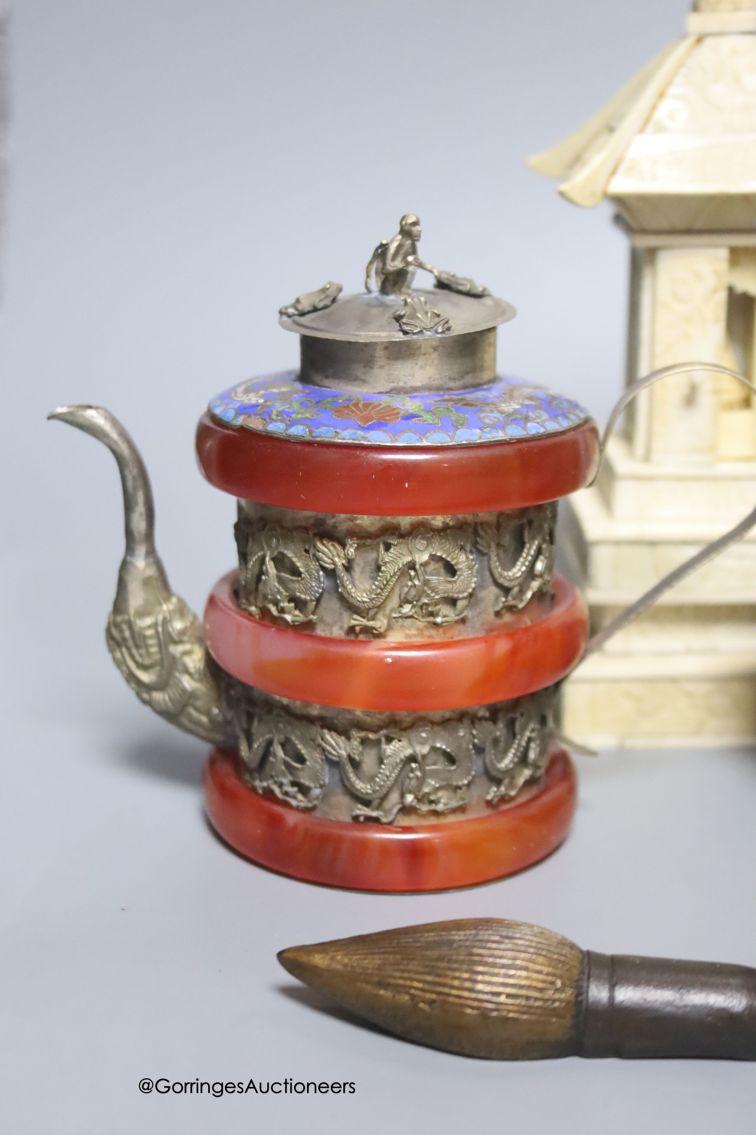 A Chinese bronze censer, teapots, a carved bone shrine, etc.